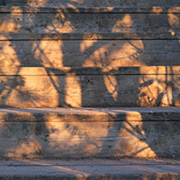 Sunset paints shadows on a staircase.