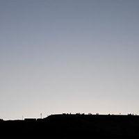 The summit of Signal Hill lined with sightseers.