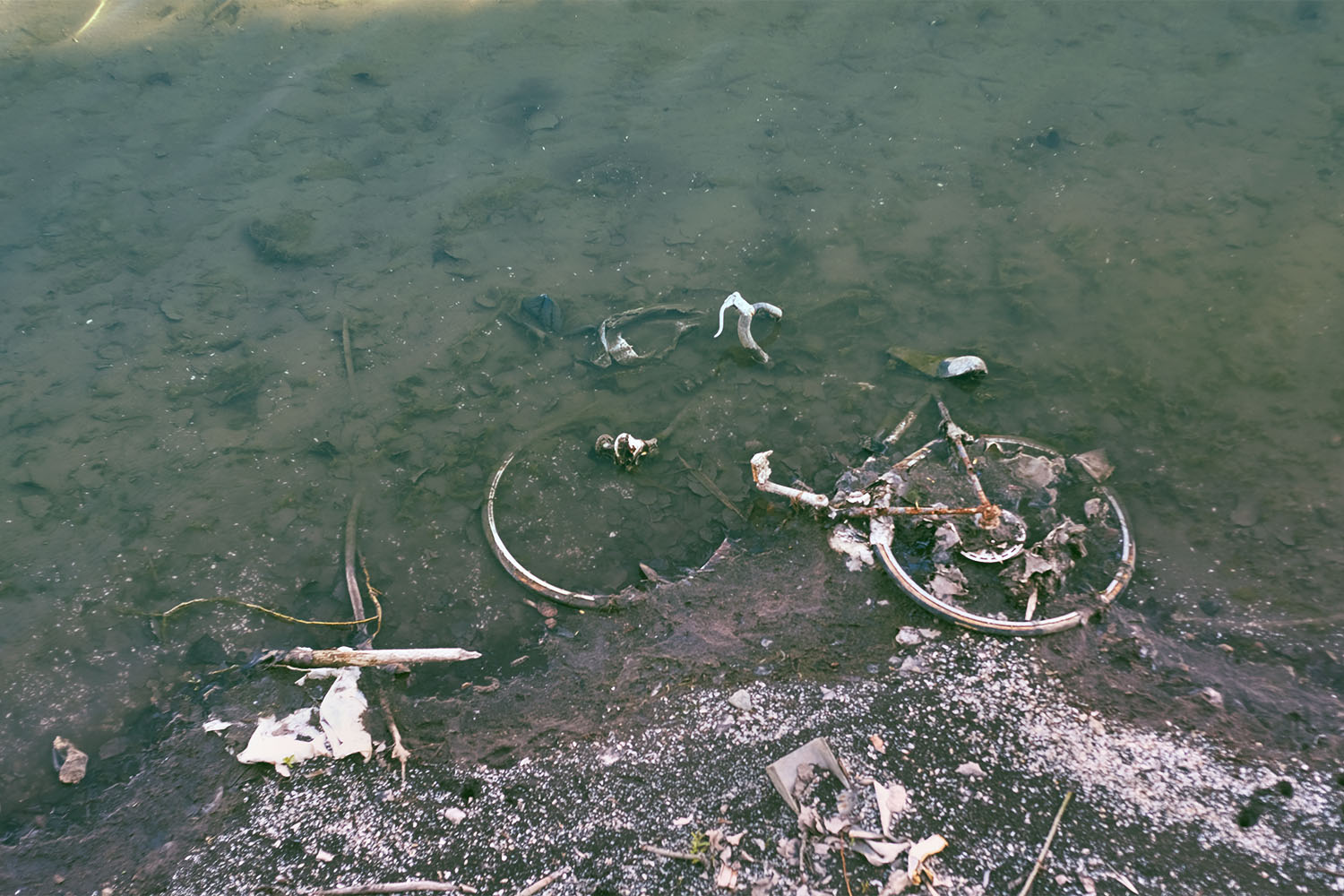 An old bicycle disintegrating in the canal.