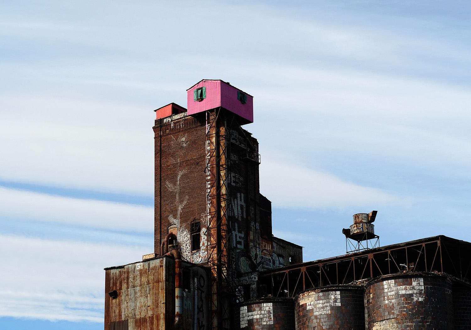 A shed painted pink atop the Canada Malting Silos.